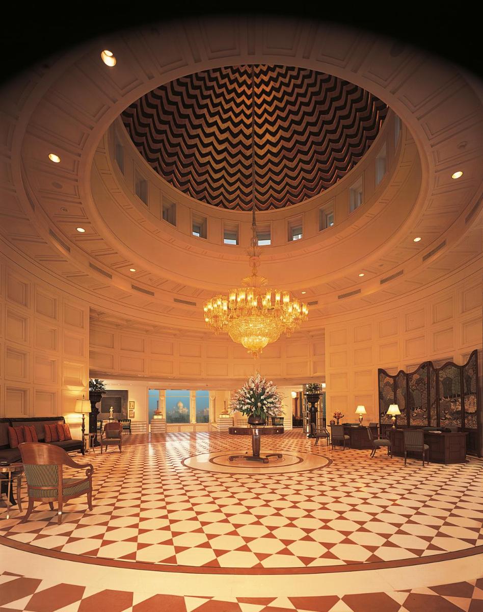 a large lobby with a chandelier in a building at The Oberoi Amarvilas Agra in Agra