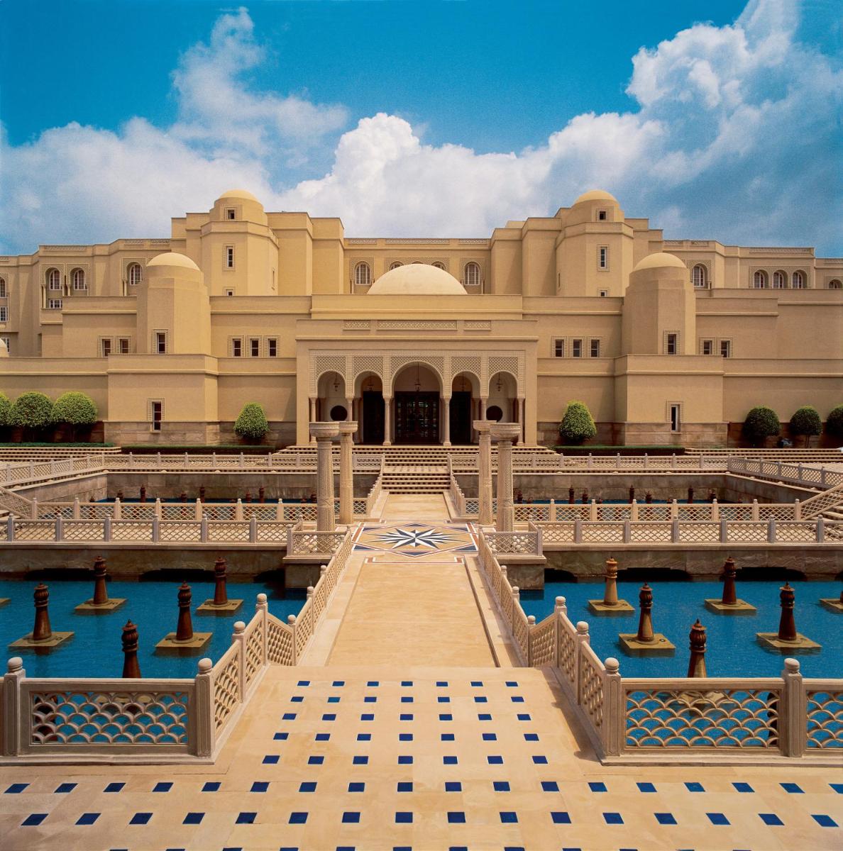a building with a pool of water in front of it at The Oberoi Amarvilas Agra in Agra