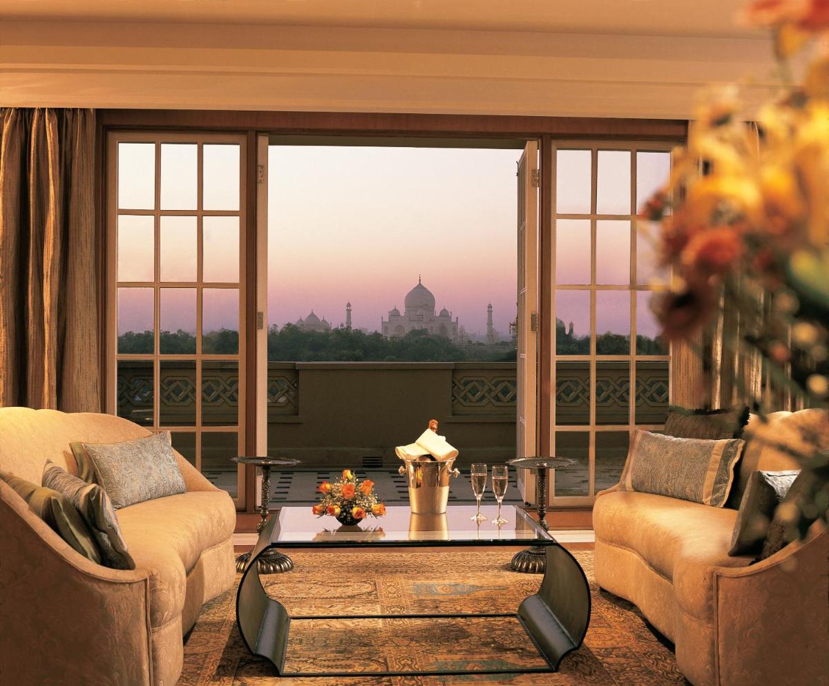 a living room with a view of the taj mahal at The Oberoi Amarvilas Agra in Agra