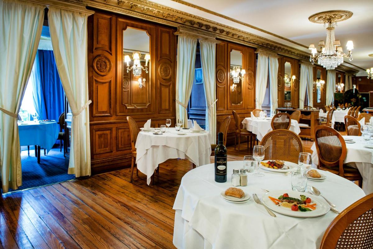 Restaurant ou autre lieu de restauration dans l'établissement Grand Hotel Gallia & Londres