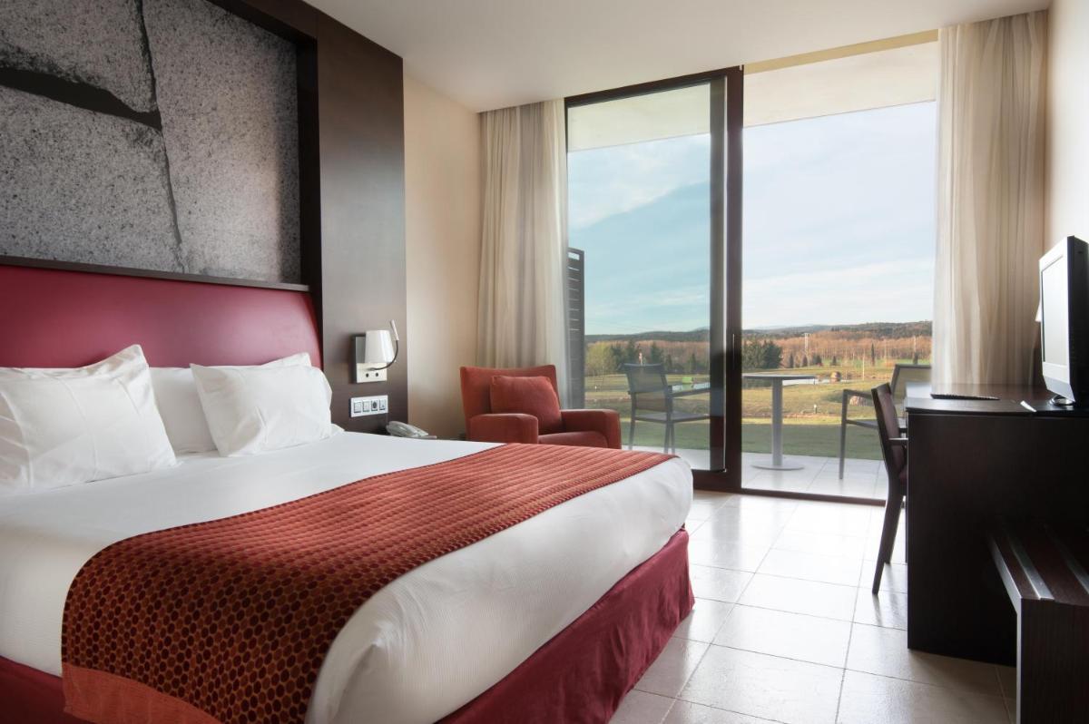 Cama o camas de una habitación en Hotel Mas Solà