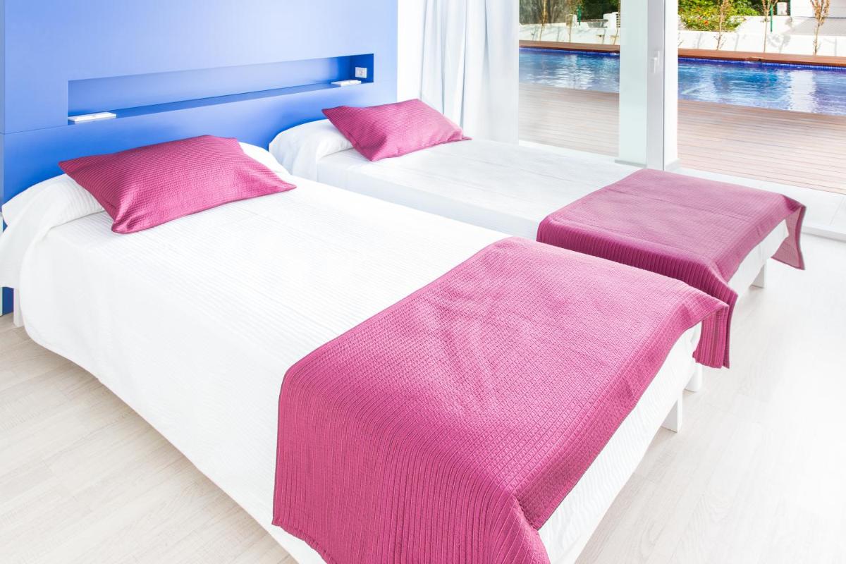 Cama o camas de una habitación en Ebano Hotel Apartments & Spa
