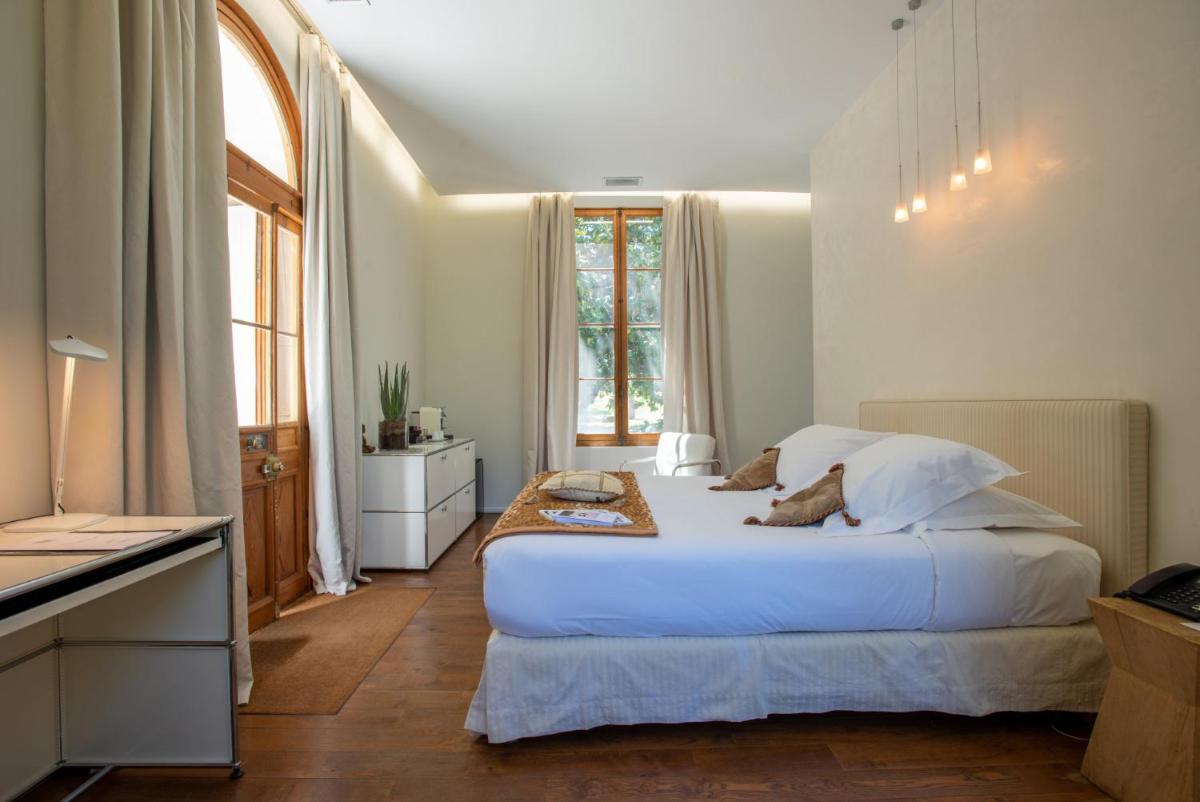 Un ou plusieurs lits dans un hébergement de l'établissement Hotel Château Des Alpilles
