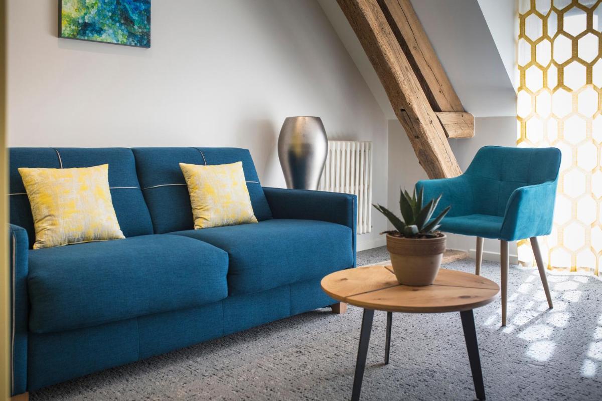 Coin salon dans l'établissement Maison Doucet - Relais & Châteaux