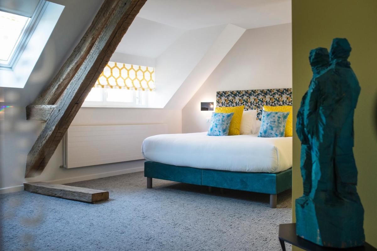 Un ou plusieurs lits dans un hébergement de l'établissement Maison Doucet - Relais & Châteaux