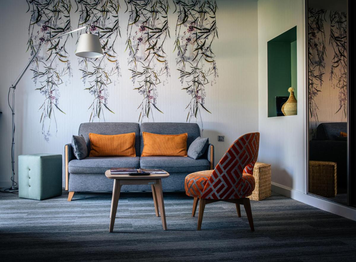 Coin salon dans l'établissement Maison Doucet - Relais & Châteaux