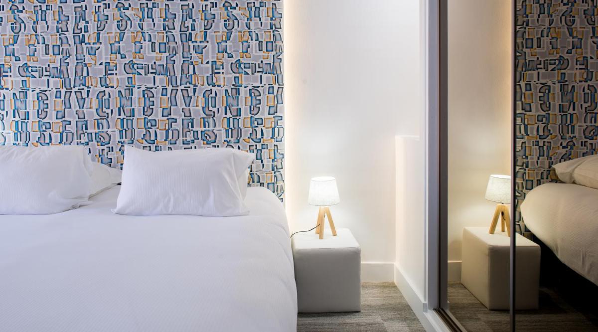 Un ou plusieurs lits dans un hébergement de l'établissement Maison Doucet - Relais & Châteaux