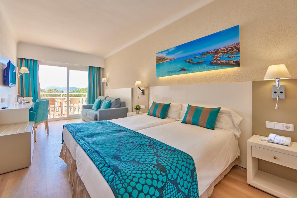 Cama o camas de una habitación en Universal Hotel Lido Park & Spa