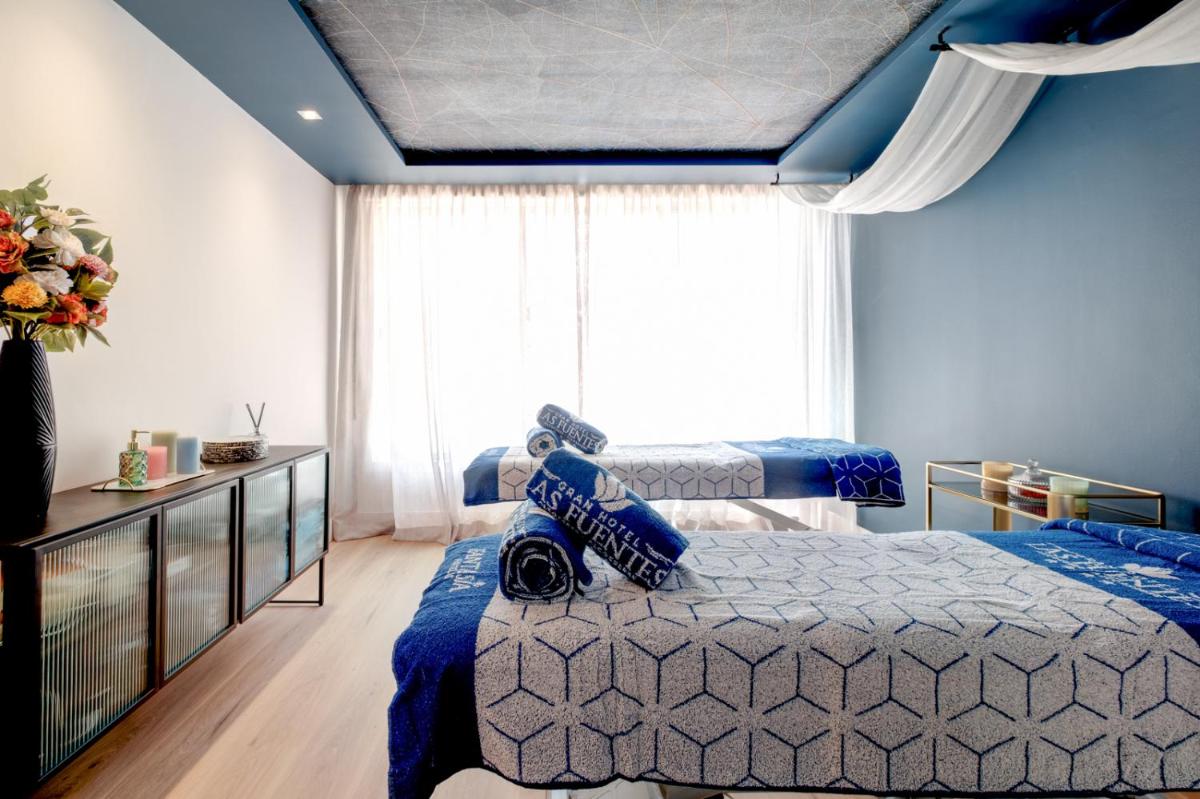 Cama o camas de una habitación en Gran Hotel Las Fuentes