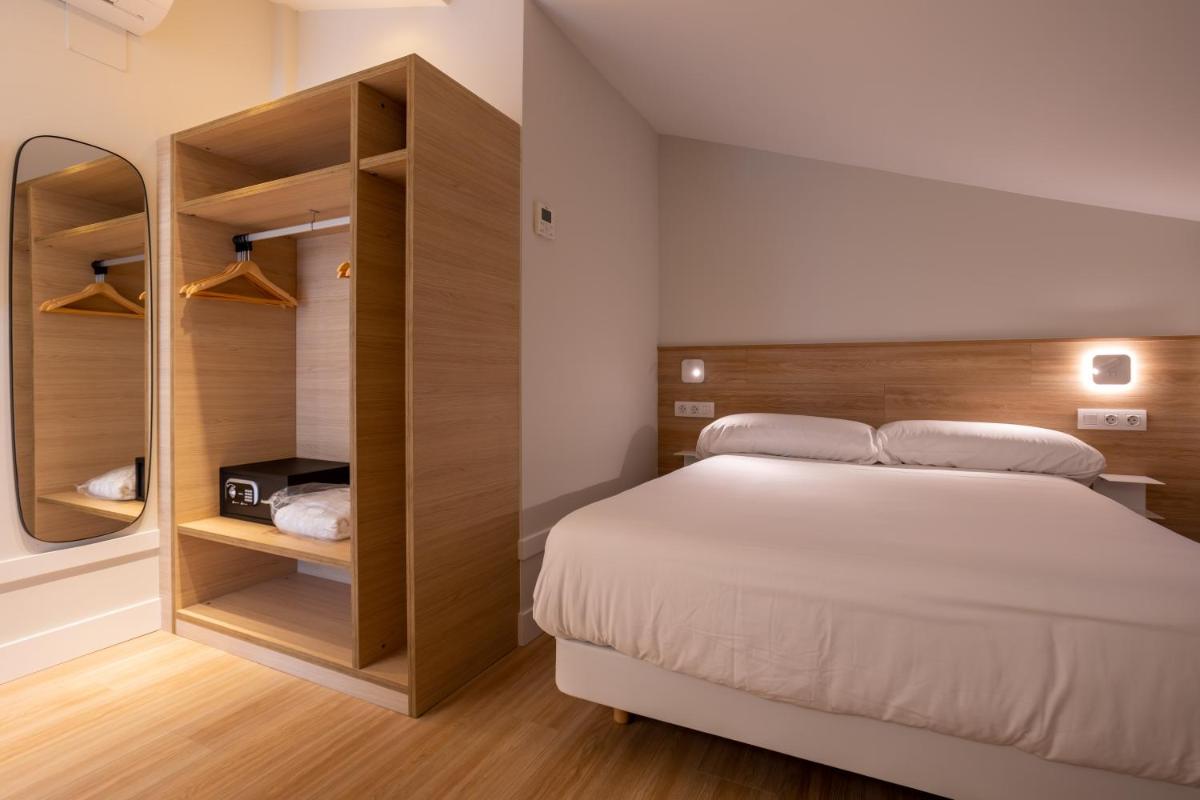 Cama o camas de una habitación en Apartamentos&Spa Mundakaport