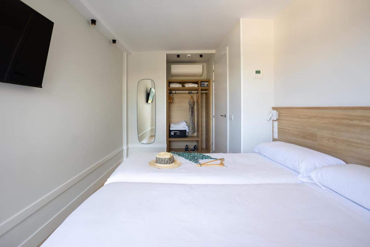 Cama o camas de una habitación en Apartamentos&Spa Mundakaport