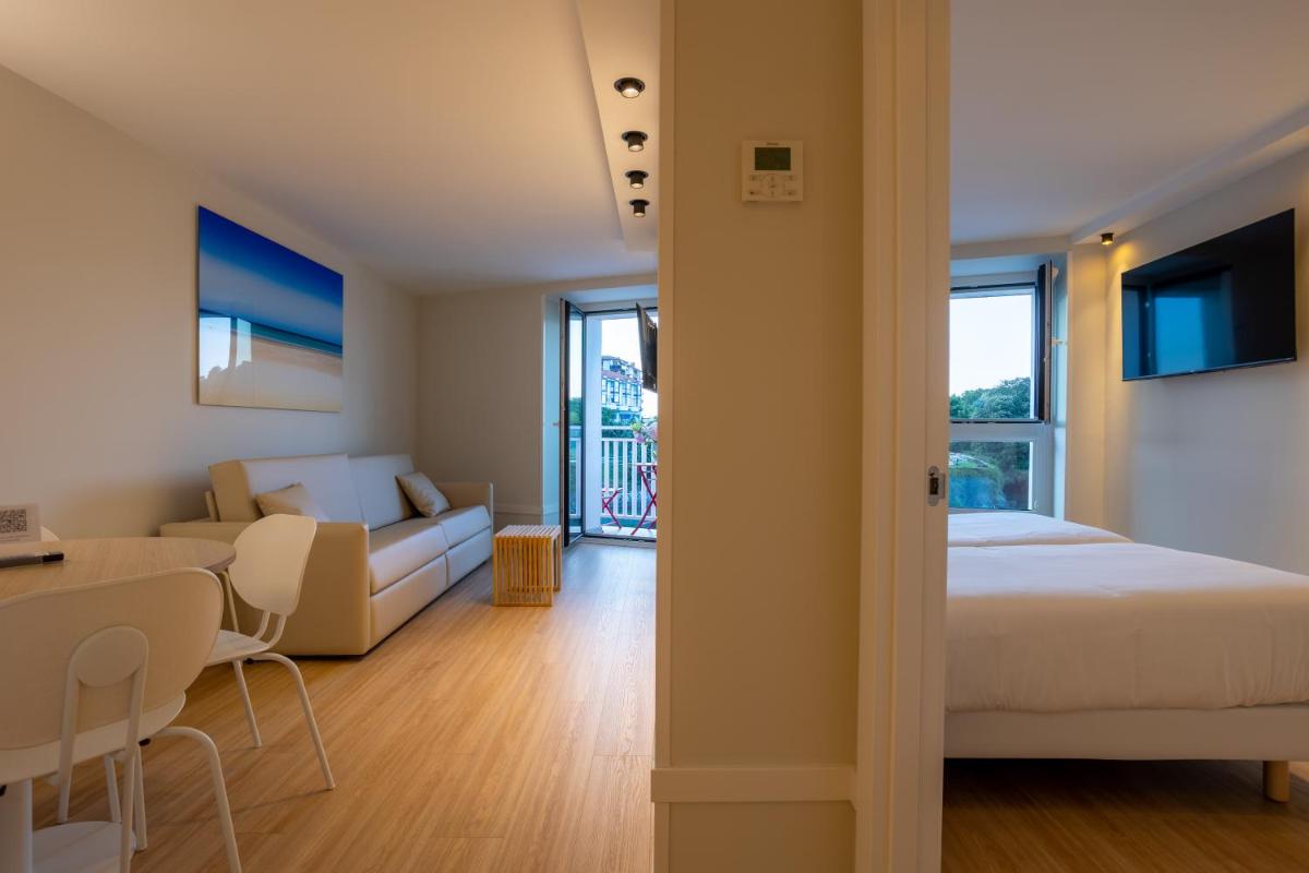 Cama o camas de una habitación en Apartamentos&Spa Mundakaport
