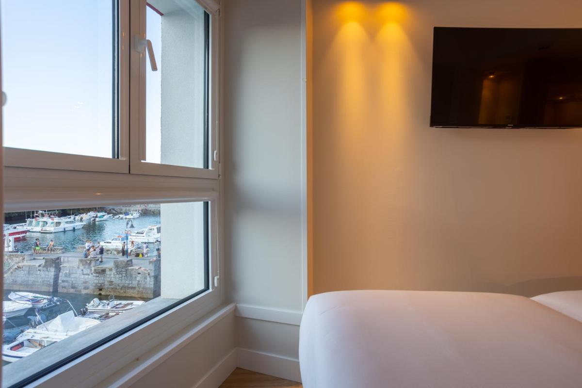Cama o camas de una habitación en Apartamentos&Spa Mundakaport