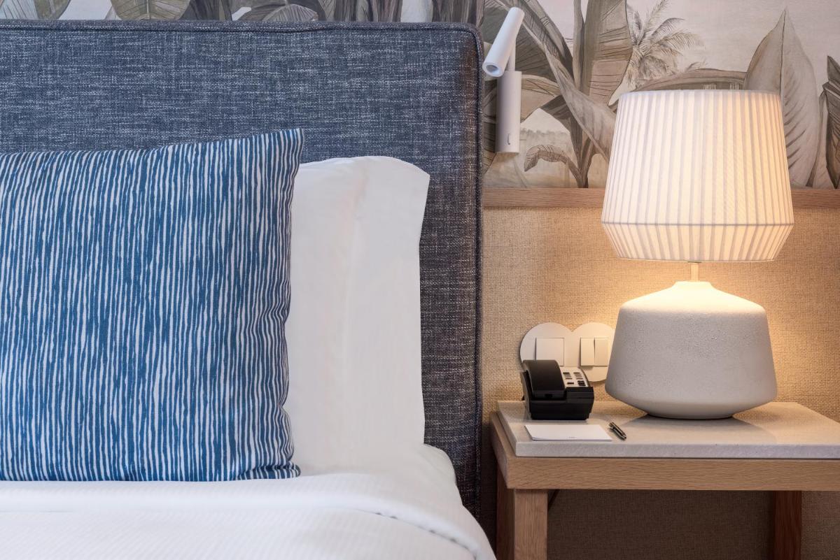 Uma cama ou camas num quarto em Domes Lake Algarve, Autograph Collection