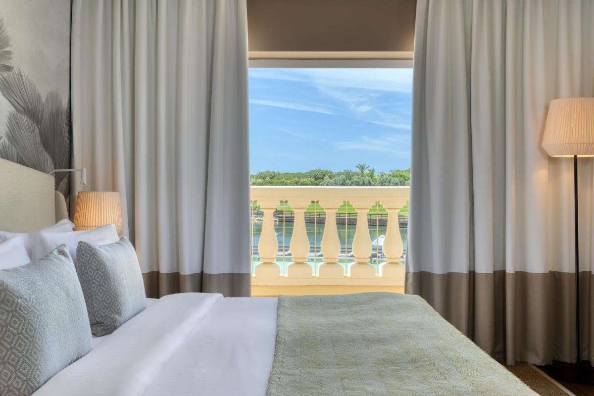Uma cama ou camas num quarto em Domes Lake Algarve, Autograph Collection