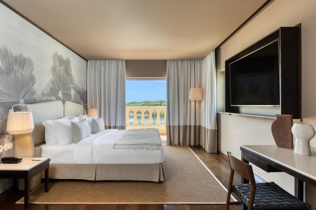 Uma cama ou camas num quarto em Domes Lake Algarve, Autograph Collection