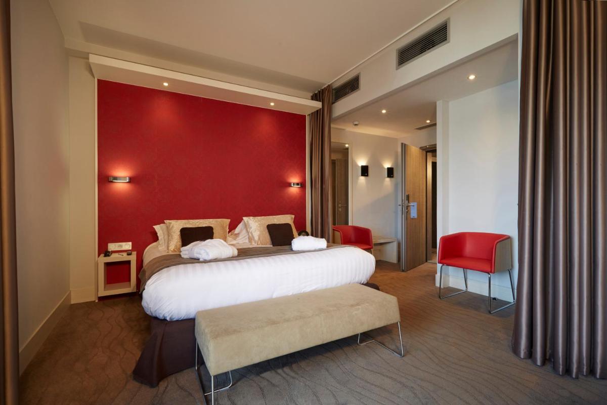 Un ou plusieurs lits dans un hébergement de l'établissement Kyriad Prestige Lyon Est - Saint Priest Eurexpo Hotel and SPA