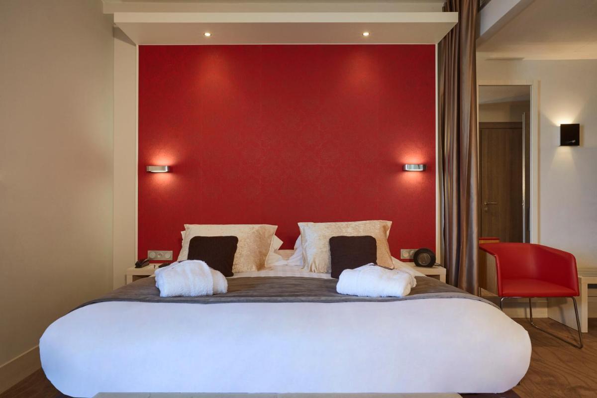 Un ou plusieurs lits dans un hébergement de l'établissement Kyriad Prestige Lyon Est - Saint Priest Eurexpo Hotel and SPA