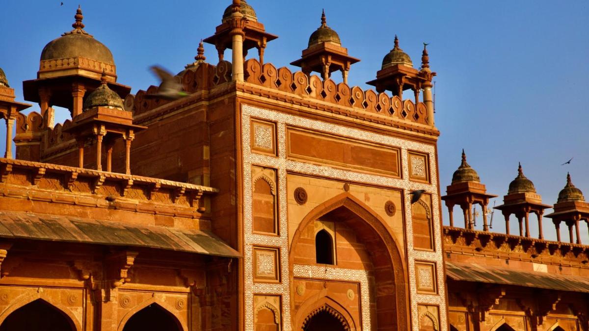 a building with turrets and domes on top of it at Holiday Inn Agra MG Road an IHG Hotel in Agra
