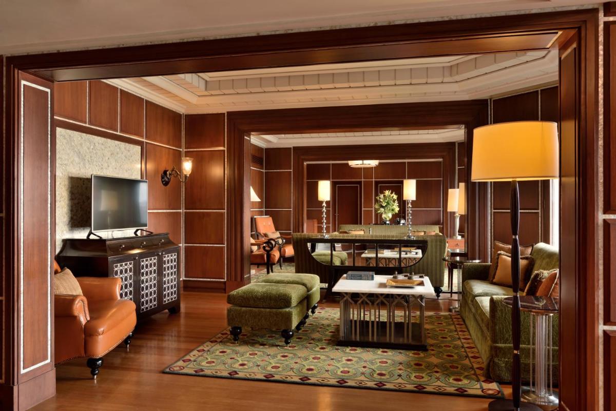 a living room with a couch and a table at Hyderabad Marriott Hotel & Convention Centre in Hyderabad