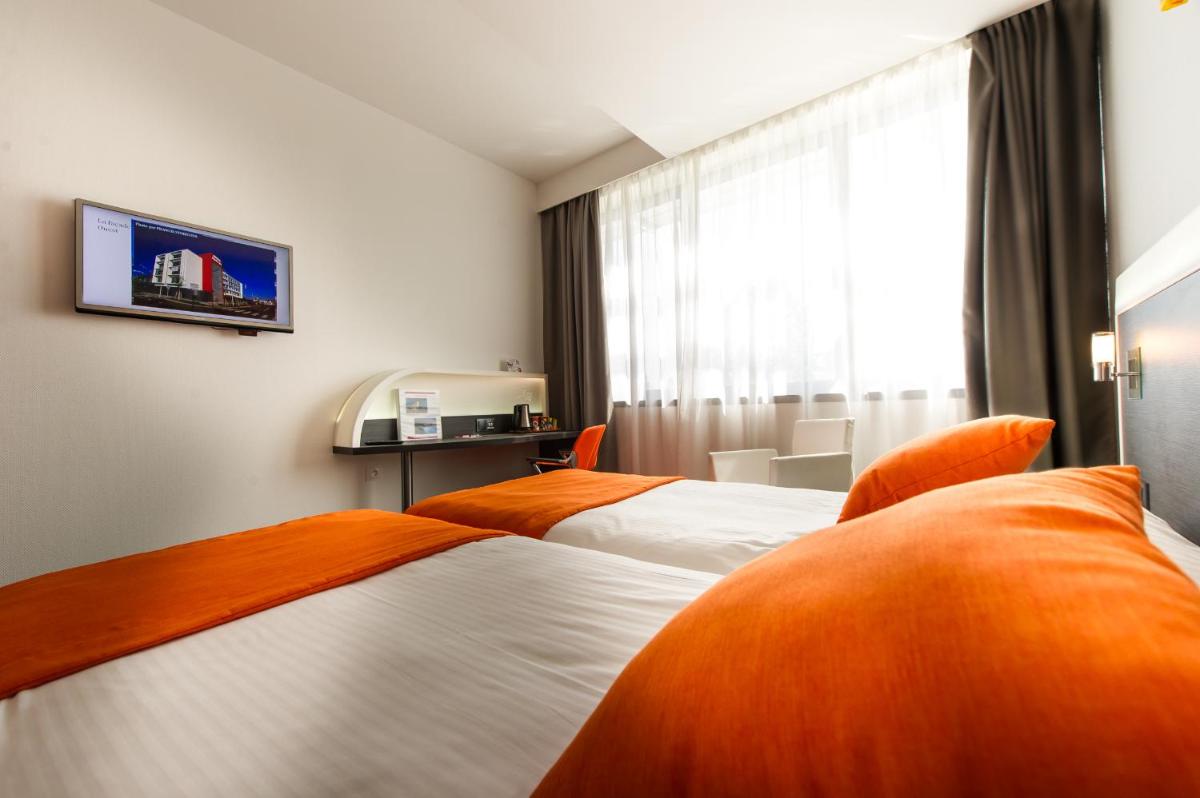 Un ou plusieurs lits dans un hébergement de l'établissement Hôtel Restaurant Athena Spa