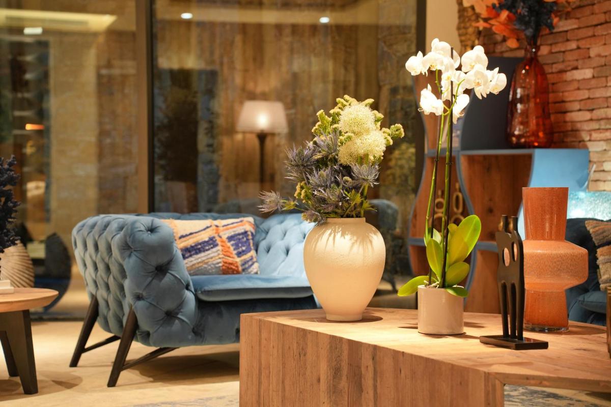 Coin salon dans l'établissement Les Regalia Hôtel & Spa