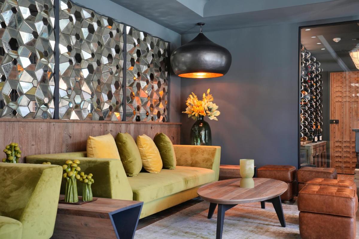 Coin salon dans l'établissement Les Regalia Hôtel & Spa