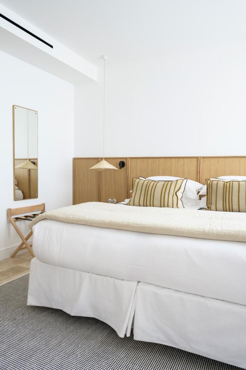 Un ou plusieurs lits dans un hébergement de l'établissement Le Couvent des Minimes, un Hôtel & Spa L'Occitane en Provence