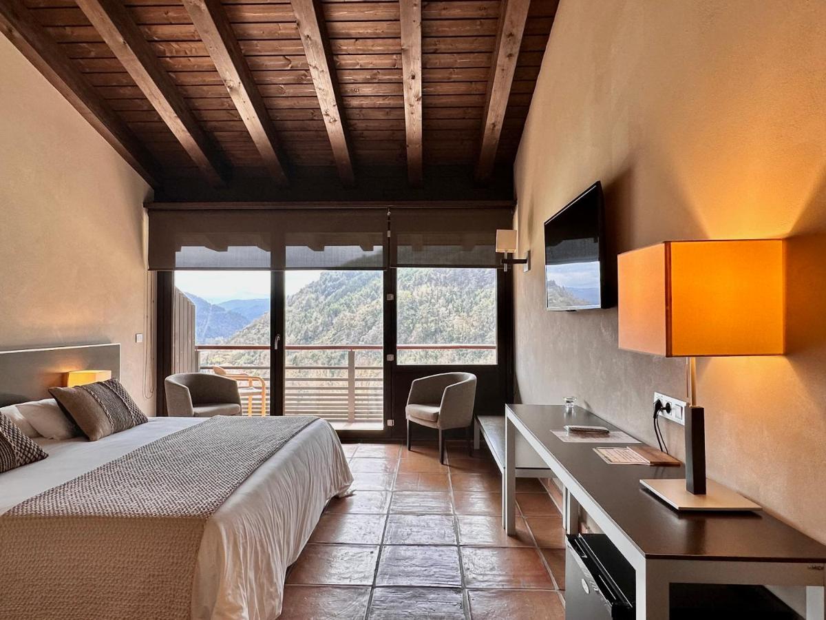 Cama o camas de una habitación en Hotel Rural-Spa Resguard Dels Vents