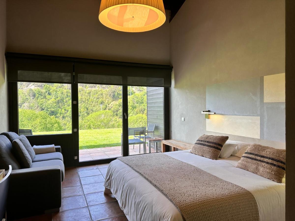 Cama o camas de una habitación en Hotel Rural-Spa Resguard Dels Vents