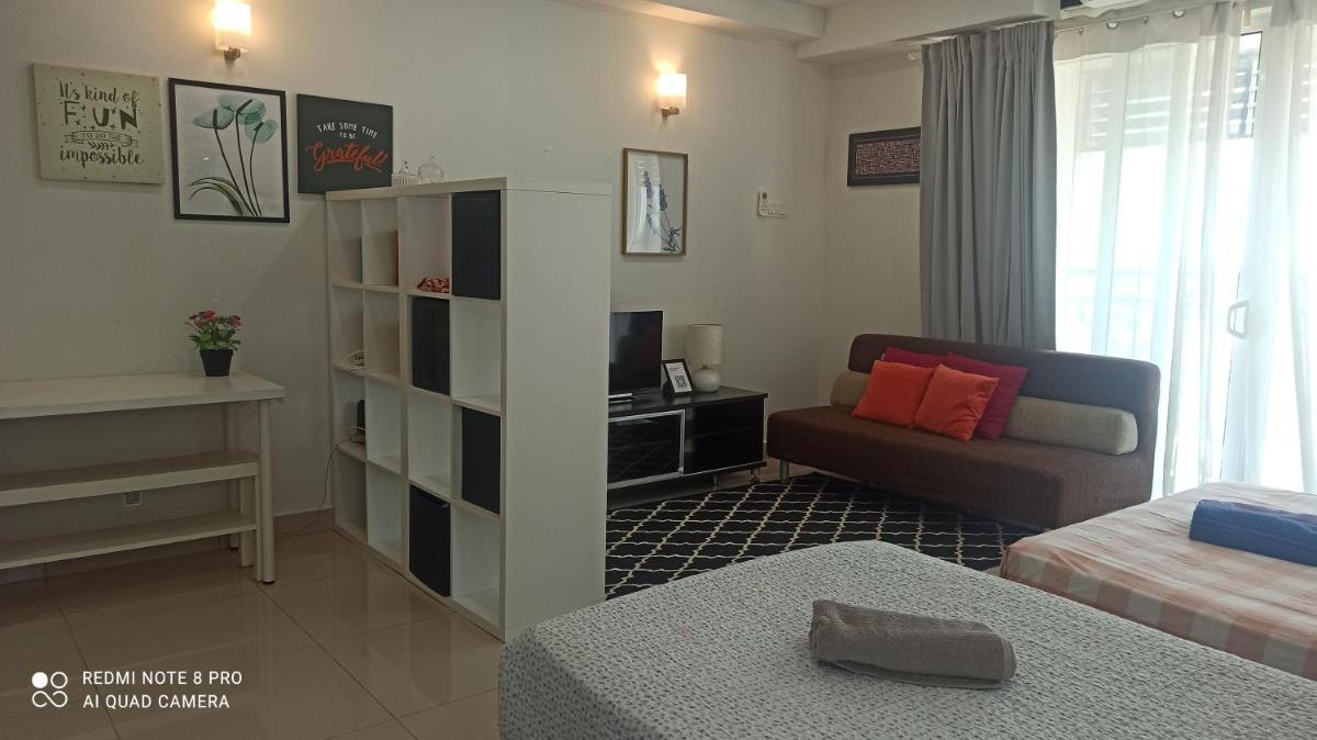 Zulanie Family Studio at D'Perdana Apartment, Spacious and Cozy with POOL, Free Wifi & Netflix - Housity
