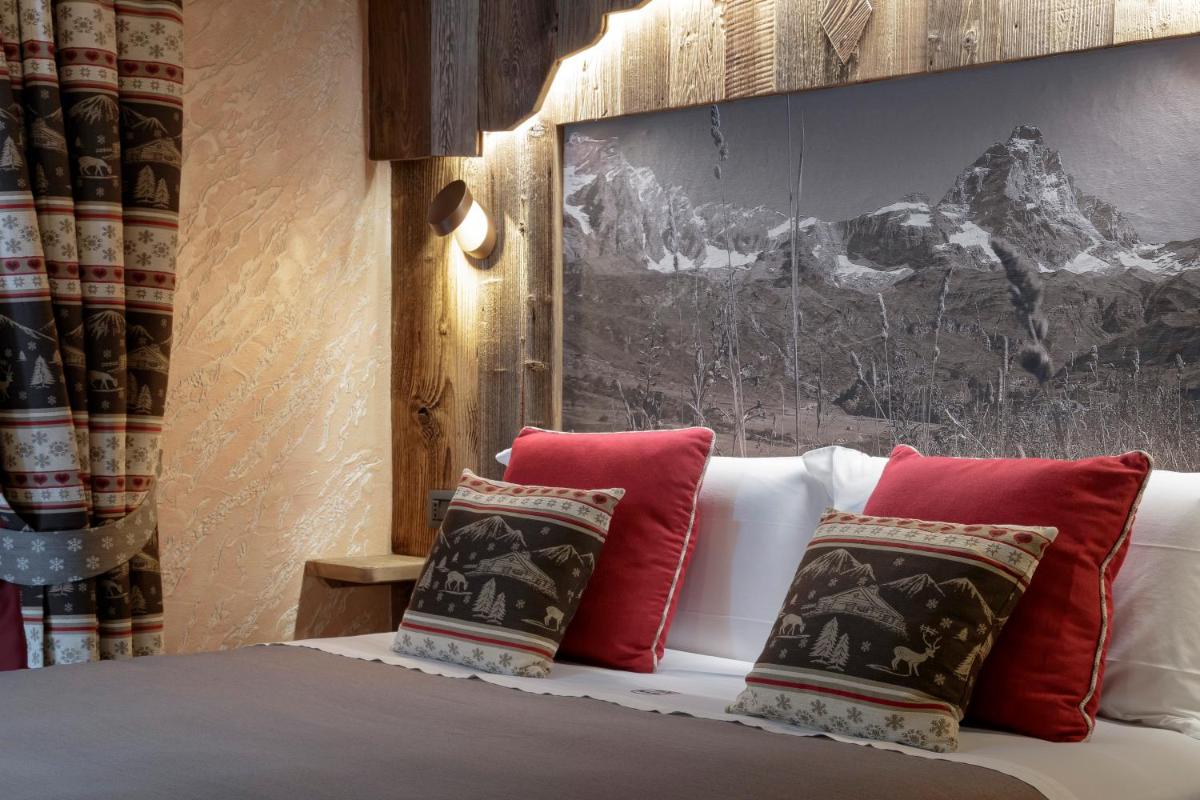 Matterhorn Retreat Francois - Camere in centro Cervina con Colazione, Accesso SPA e WiFi - Housity
