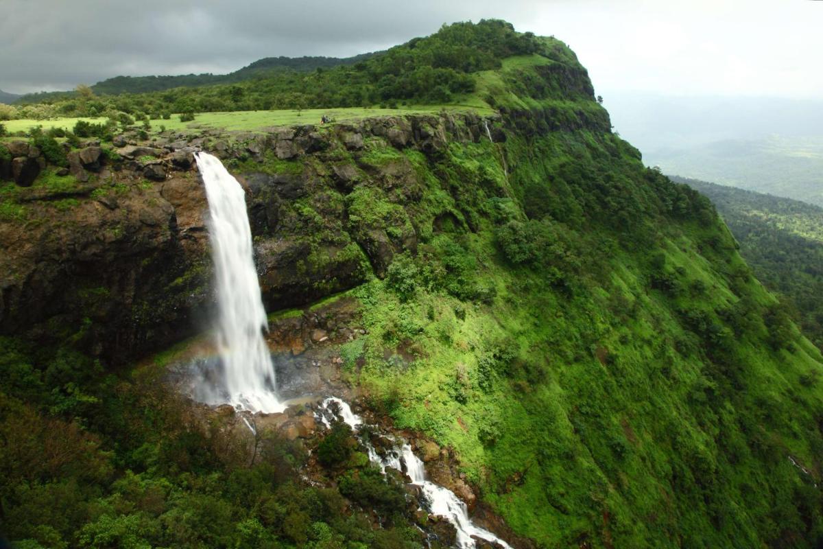 a waterfall on the side of a mountain at Radisson Blu Hotel Pune Kharadi in Pune