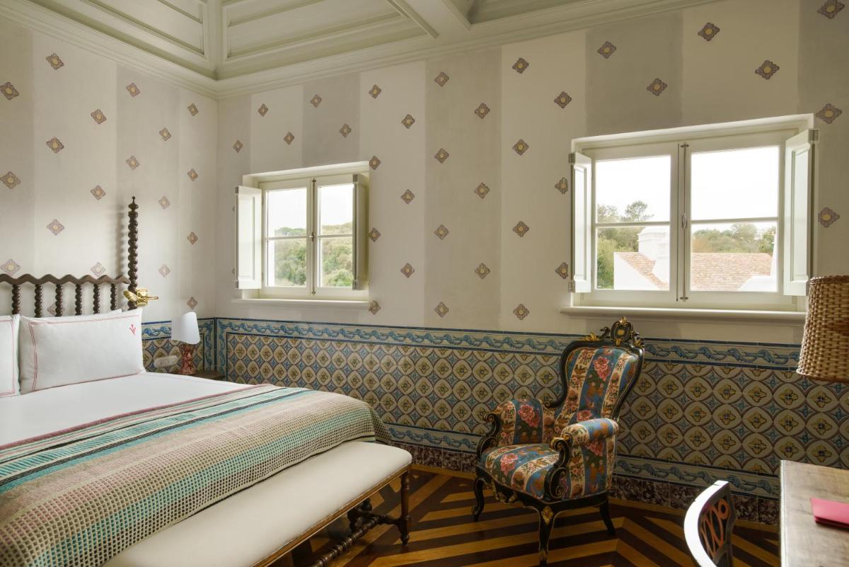 Uma cama ou camas num quarto em Vermelho Melides - Relais & Châteaux