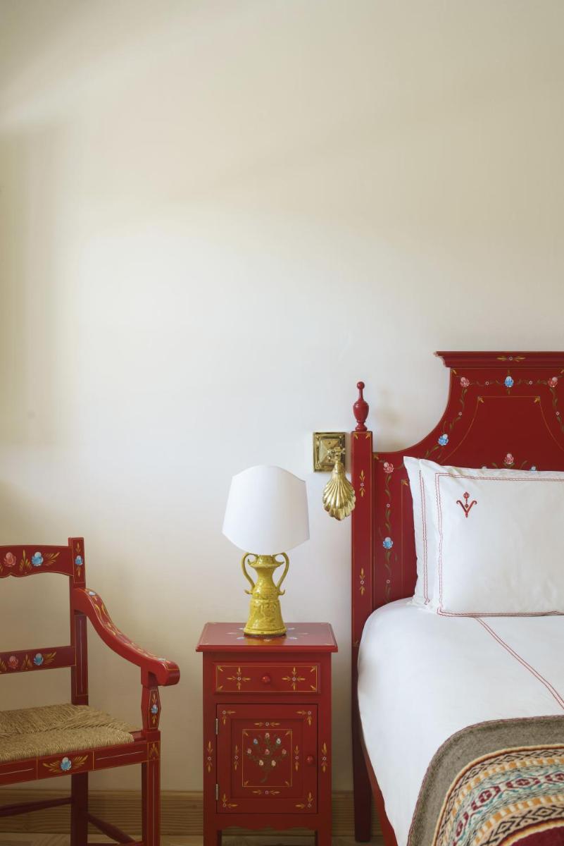 Uma cama ou camas num quarto em Vermelho Melides - Relais & Châteaux