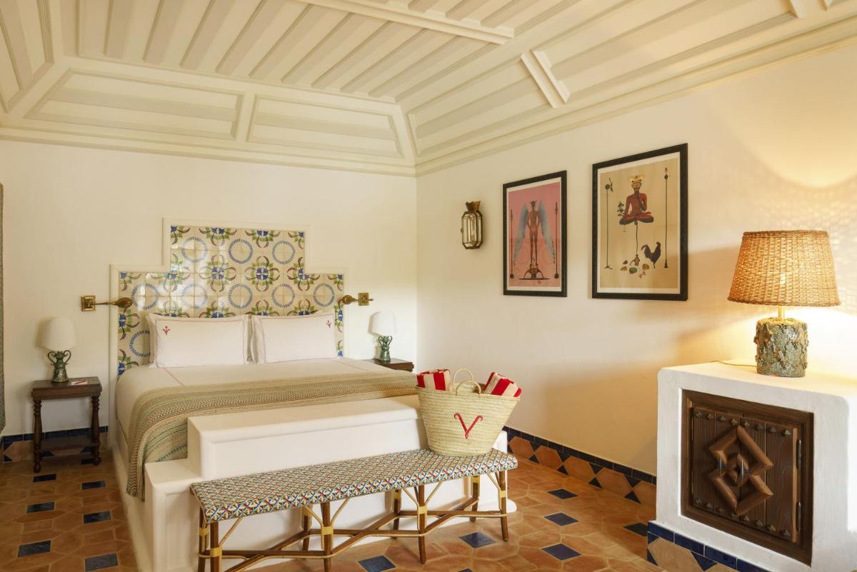 Uma cama ou camas num quarto em Vermelho Melides - Relais & Châteaux