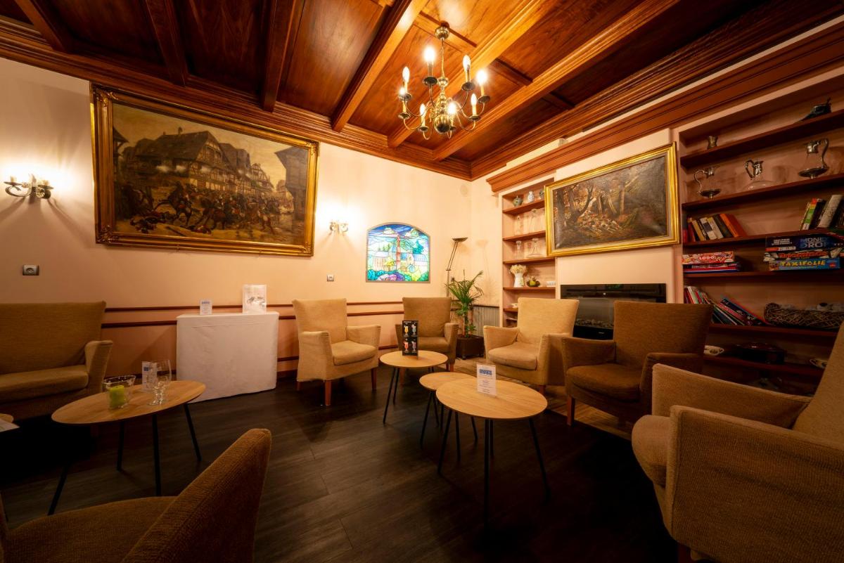 Coin salon dans l'établissement Hotel Munsch Restaurant & Wellness, Colmar Nord - Haut-Koenigsbourg