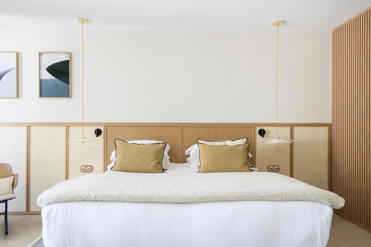 Un ou plusieurs lits dans un hébergement de l'établissement Le Couvent des Minimes, un Hôtel & Spa L'Occitane en Provence