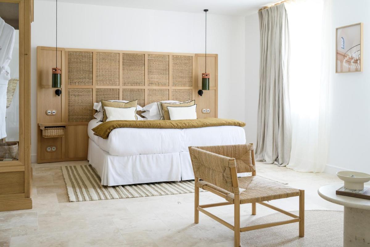 Un ou plusieurs lits dans un hébergement de l'établissement Le Couvent des Minimes, un Hôtel & Spa L'Occitane en Provence