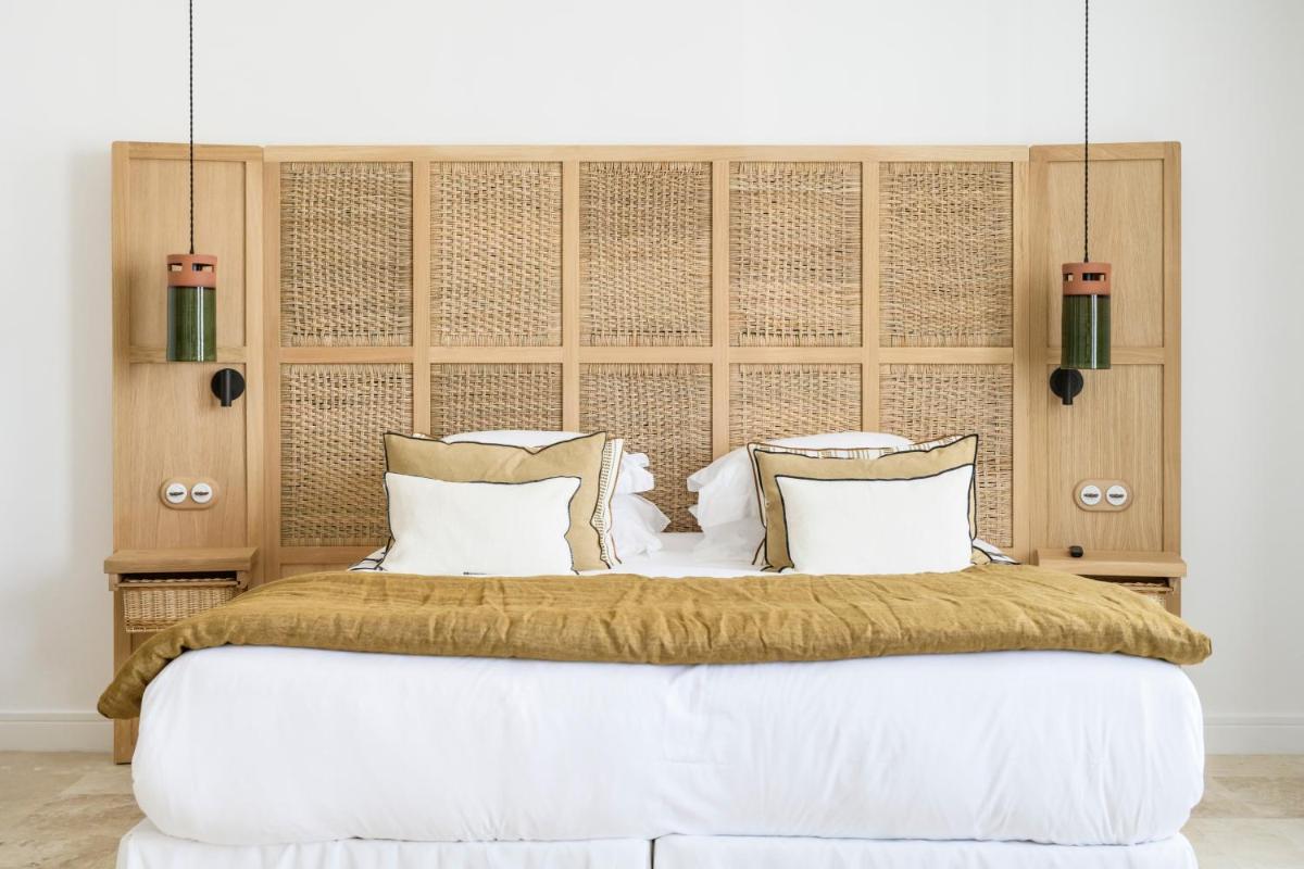 Un ou plusieurs lits dans un hébergement de l'établissement Le Couvent des Minimes, un Hôtel & Spa L'Occitane en Provence