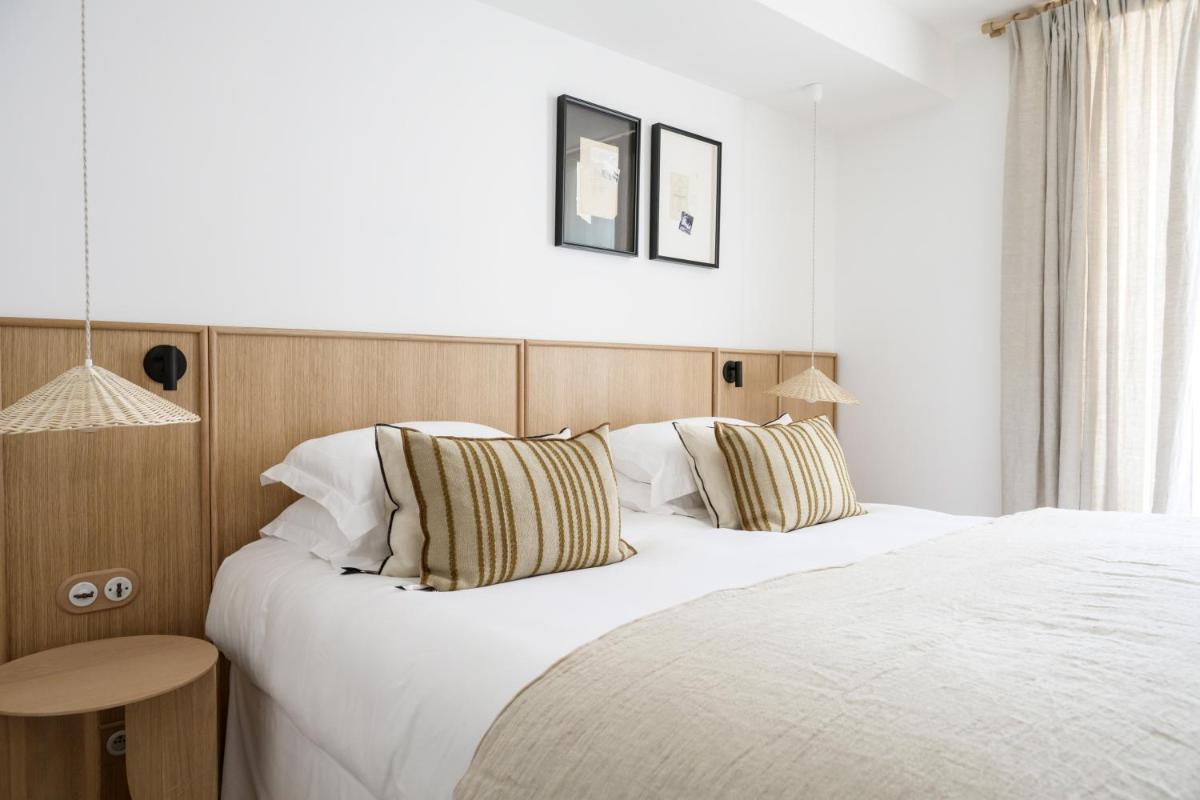 Un ou plusieurs lits dans un hébergement de l'établissement Le Couvent des Minimes, un Hôtel & Spa L'Occitane en Provence