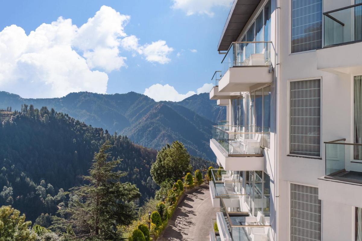 a view from the side of a building with mountains in the background at Welcomhotel by ITC Hotels, Shimla in Shimla