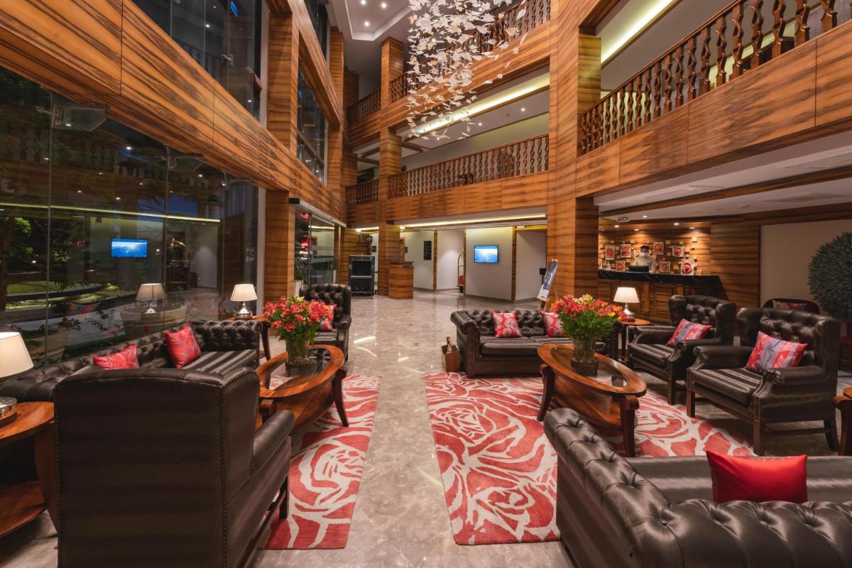 a hotel lobby with couches and tables and a lobby at Welcomhotel by ITC Hotels, Shimla in Shimla