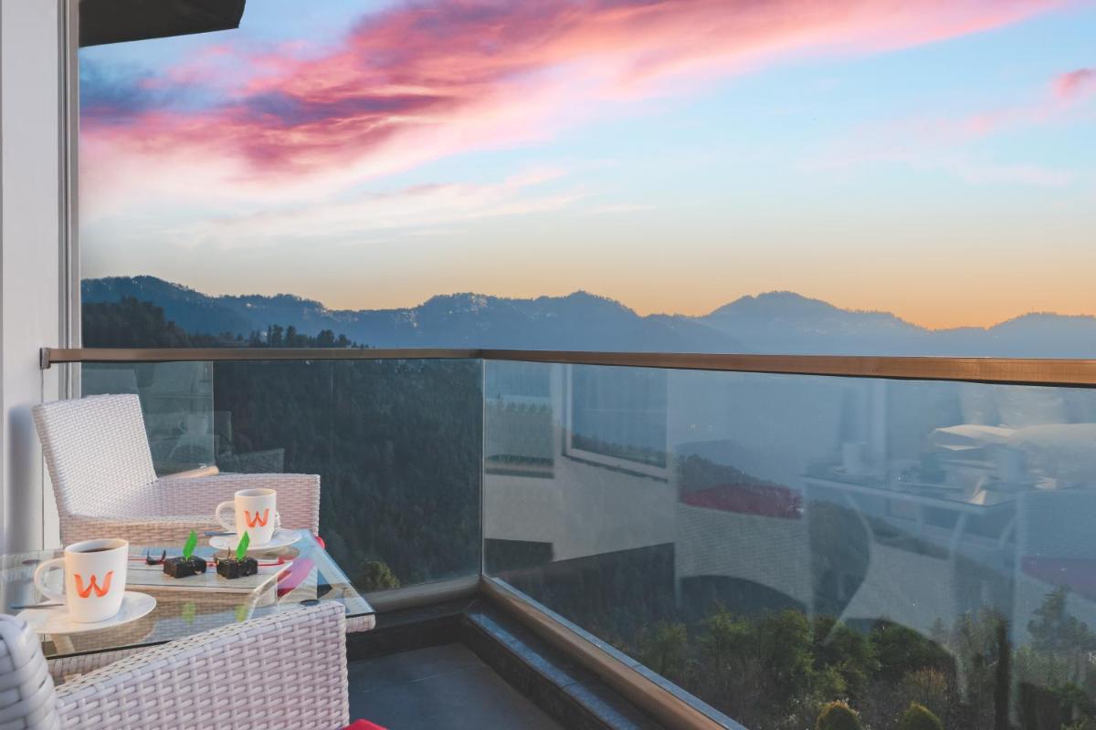 a balcony with a view of the mountains at Welcomhotel by ITC Hotels, Shimla in Shimla