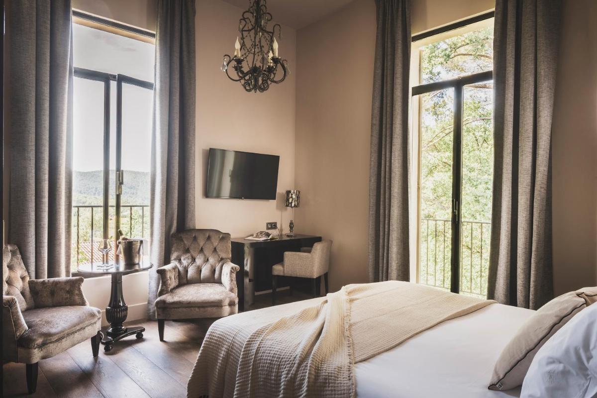 Un ou plusieurs lits dans un hébergement de l'établissement Les Lodges Sainte-Victoire Hotel & Spa