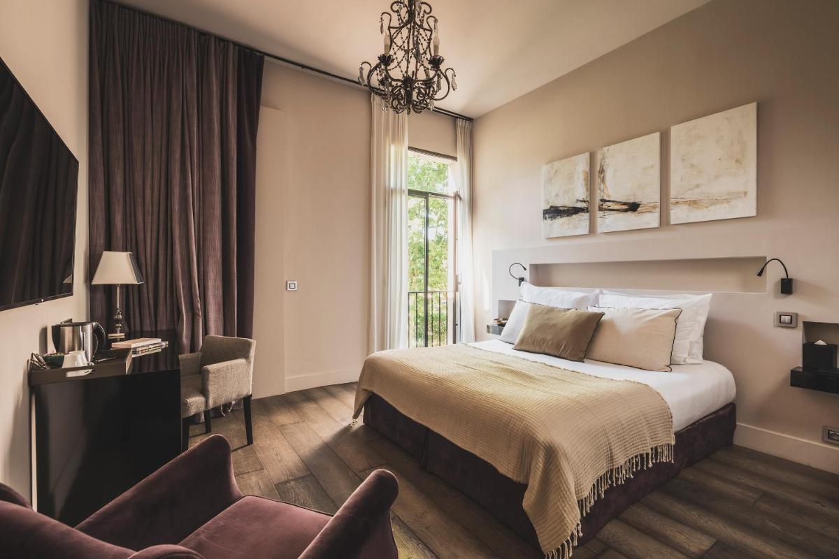 Un ou plusieurs lits dans un hébergement de l'établissement Les Lodges Sainte-Victoire Hotel & Spa