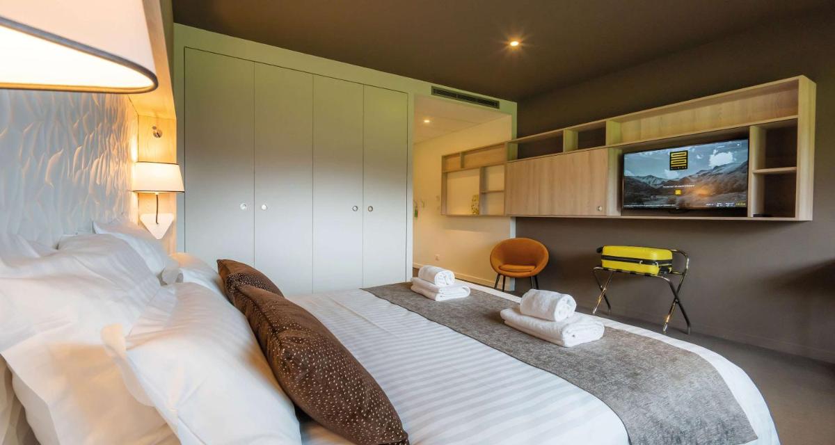 Un ou plusieurs lits dans un hébergement de l'établissement Mildiss Hotel Spa & Restaurant, BW Signature Collection