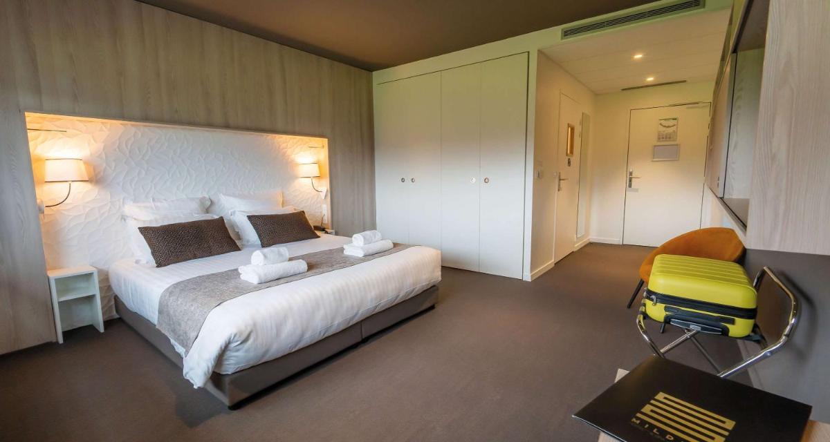 Un ou plusieurs lits dans un hébergement de l'établissement Mildiss Hotel Spa & Restaurant, BW Signature Collection