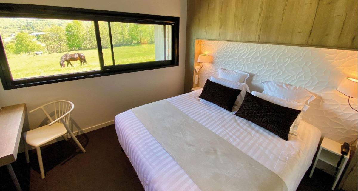 Un ou plusieurs lits dans un hébergement de l'établissement Mildiss Hotel Spa & Restaurant, BW Signature Collection