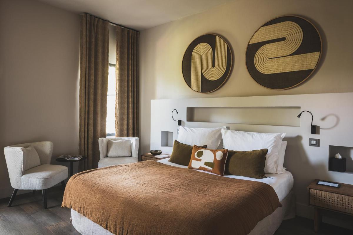 Un ou plusieurs lits dans un hébergement de l'établissement Les Lodges Sainte-Victoire Hotel & Spa